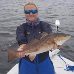 Bobbi Brady holding a large fish