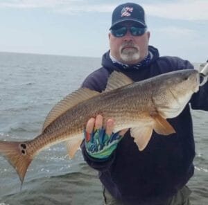 Mark Brady holding a large redfish