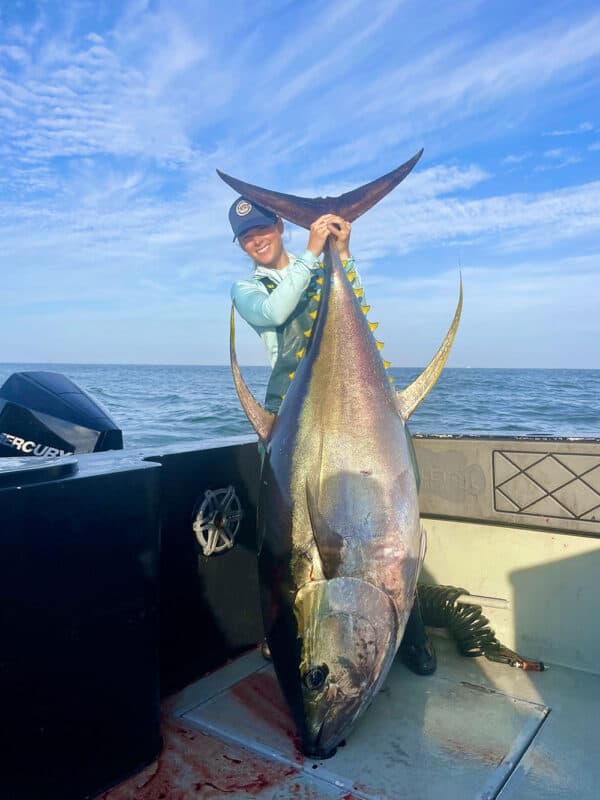 Fisherman holding a large tuna