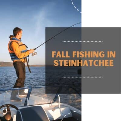 Man fishing from the front of a boat wearing a life vest